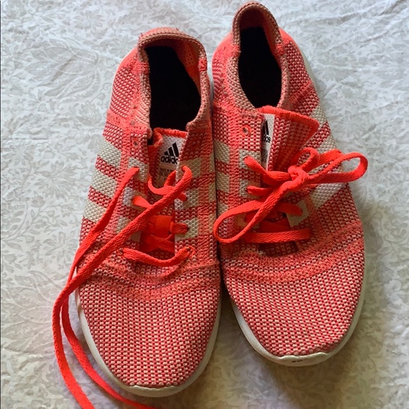 neon pink adidas sneakers